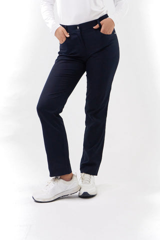 Navy Ladies golf trousers made from flexible lightweight 4 way stretch material.  Featuring a zip and button fastening with five belt loops, a regular fit with anti-crease and anti-static properties. These women's golf trousers have two open pockets to the front and back. Size 8 to 20.