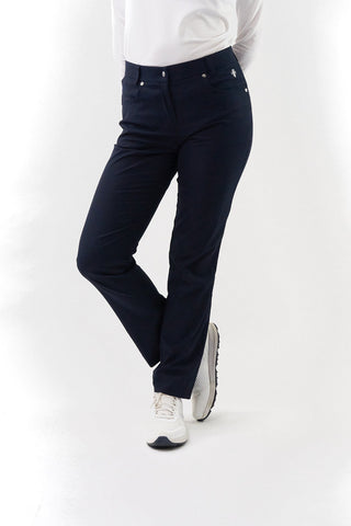 Navy Ladies golf trousers made from flexible lightweight 4 way stretch material.  Featuring a zip and button fastening with five belt loops, a regular fit with anti-crease and anti-static properties. These women's golf trousers have two open pockets to the front and back. Size 8 to 20.