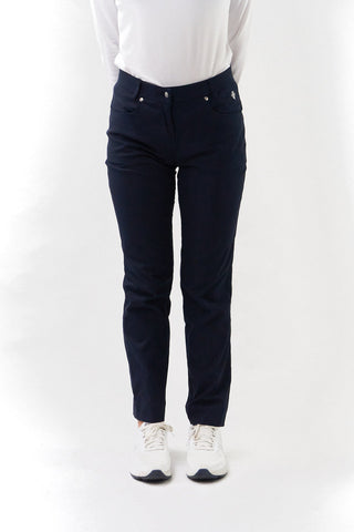 Navy Ladies golf trousers made from flexible lightweight 4 way stretch material.  Featuring a zip and button fastening with five belt loops, a regular fit with anti-crease and anti-static properties. These women's golf trousers have two open pockets to the front and back. Size 8 to 20.