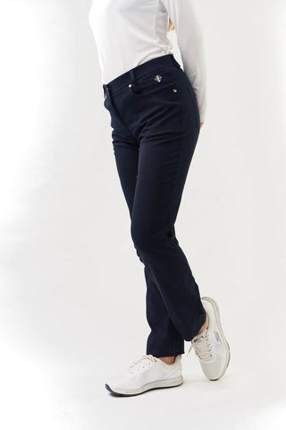 Navy Ladies golf trousers made from flexible lightweight 4 way stretch material.  Featuring a zip and button fastening with five belt loops, a regular fit with anti-crease and anti-static properties. These women's golf trousers have two open pockets to the front and back. Size 8 to 20.