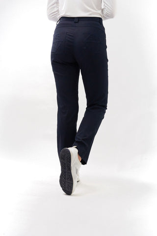 Navy Ladies golf trousers made from flexible lightweight 4 way stretch material.  Featuring a zip and button fastening with five belt loops, a regular fit with anti-crease and anti-static properties. These women's golf trousers have two open pockets to the front and back. Size 8 to 20.