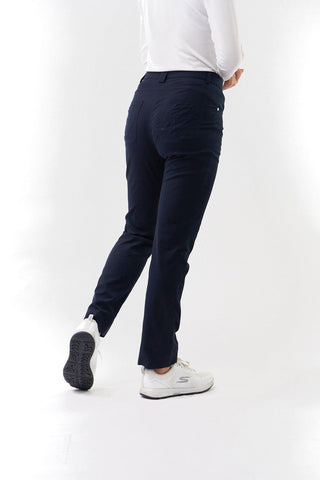 Navy Ladies golf trousers made from flexible lightweight 4 way stretch material.  Featuring a zip and button fastening with five belt loops, a regular fit with anti-crease and anti-static properties. These women's golf trousers have two open pockets to the front and back. Size 8 to 20.