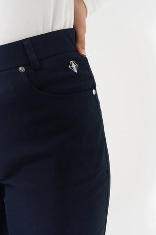 Navy Ladies golf trousers made from flexible lightweight 4 way stretch material.  Featuring a zip and button fastening with five belt loops, a regular fit with anti-crease and anti-static properties. These women's golf trousers have two open pockets to the front and back. Size 8 to 20.