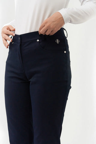 Navy Ladies golf trousers made from flexible lightweight 4 way stretch material.  Featuring a zip and button fastening with five belt loops, a regular fit with anti-crease and anti-static properties. These women's golf trousers have two open pockets to the front and back. Size 8 to 20.
