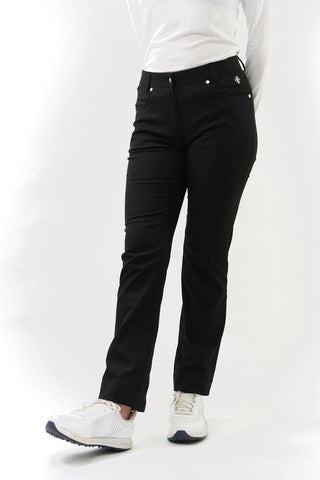 Black ladies golf trousers made from flexible lightweight 4 way stretch material.  Featuring a zip and button fastening with five belt loops, a regular fit with anti-crease and anti-static properties. These women's golf trousers have two open pockets to the front and back. Size 8 to 20.