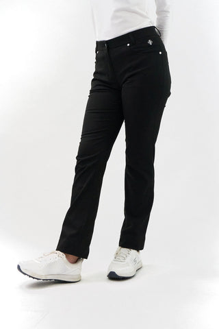 Black Ladies golf trousers made from flexible lightweight 4 way stretch material.  Featuring a zip and button fastening with five belt loops, a regular fit with anti-crease and anti-static properties. These women's golf trousers have two open pockets to the front and back. Size 8 to 20.