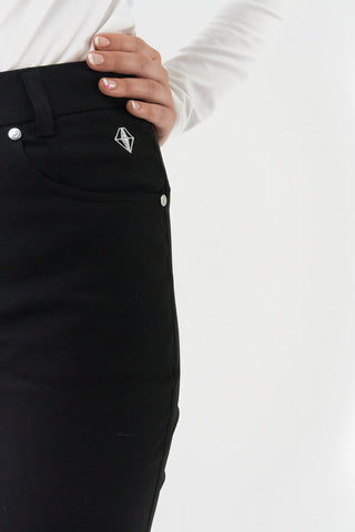 Black ladies golf trousers made from flexible lightweight 4 way stretch material.  Featuring a zip and button fastening with five belt loops, a regular fit with anti-crease and anti-static properties. These women's golf trousers have two open pockets to the front and back. Size 8 to 20.