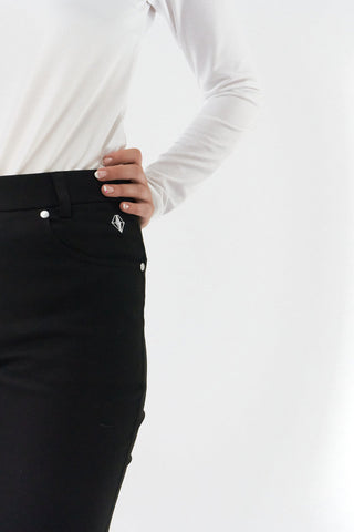 Black ladies golf trousers made from flexible lightweight 4 way stretch material.  Featuring a zip and button fastening with five belt loops, a regular fit with anti-crease and anti-static properties. These women's golf trousers have two open pockets to the front and back. Size 8 to 20.