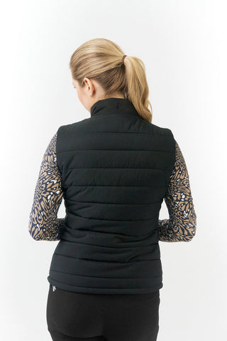 The Pure Golf Eve reversible ladies gilet for golf is insulated, winter-weight, patterned and reversible. It has been Insulated for warmth without being bulky. It has a unique animal print in wild truffle,  on one side and black on the other for versatility of wear. It has pockets on both sides and two-way zippers. The flattering quilting style and fit enhances your silhouette. The colors in this  this piece are Cappuccino,  Champagne and black.