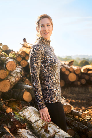 Pure Golf Arusha is a long-sleeved ladies winter weight golf top made from a super soft brushed fabric. It is two tone with a unique animal print in a soft cappuccino color with a high neckline.   A quick dry, made from UPF35, 4-way stretch, anti-crease fabric for ultimate comfort and fit.