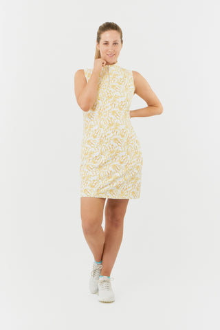 The Pure Golf model shot of the Miley Sleeveless dress features our sunkissed print and honey hues. Made in 4-way stretch material for maximum flexibility and unrestricted movement with detachable shorts for versatility and coverage. The mock neck collar offers a sleek, modern look and is a flattering fit on all body types. Designed to be anti-crease, anti-static, and quick drying. It provides UPF 50+, 95% Polyester and 5% Spandex.