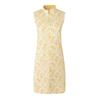 The Pure Golf product shot of the Miley Sleeveless dress features our sunkissed print and honey hues. Made in 4-way stretch material for maximum flexibility and unrestricted movement with detachable shorts for versatility and coverage. The mock neck collar offers a sleek, modern look and is a flattering fit on all body types. Designed to be anti-crease, anti-static, and quick drying. It provides UPF 50+, 95% Polyester and 5% Spandex.