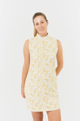 The Pure Golf close up model shot of the Miley Sleeveless dress features our sunkissed print and honey hues. Made in 4-way stretch material for maximum flexibility and unrestricted movement with detachable shorts for versatility and coverage. The mock neck collar offers a sleek, modern look and is a flattering fit on all body types. Designed to be anti-crease, anti-static, and quick drying. It provides UPF 50+, 95% Polyester and 5% Spandex.
