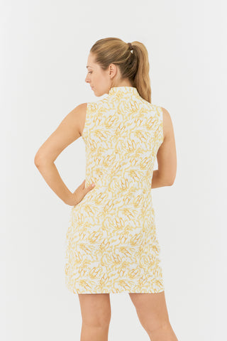 The Pure Golf model shot of the Miley Sleeveless dress from the back features our sunkissed print and honey hues. Made in 4-way stretch material for maximum flexibility and unrestricted movement with detachable shorts for versatility and coverage. The mock neck collar offers a sleek, modern look and is a flattering fit on all body types. Designed to be anti-crease, anti-static, and quick drying. It provides UPF 50+, 95% Polyester and 5% Spandex.