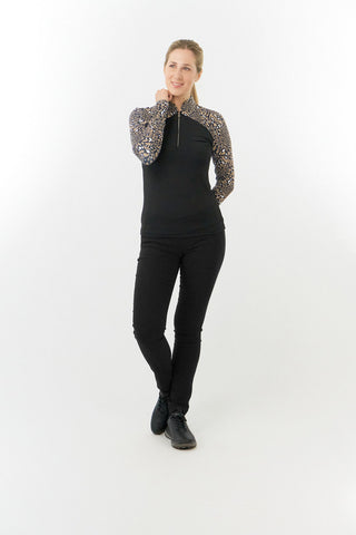 Pure Golf Maple is a long-sleeved golf top for ladies made from a super soft winterweight fabric that is brushed on the inside. With printed sleeves and shoulders patterned in brown, black and white for an extra flattering silhouette. The top has a quarter zip with a diamond logo zipper puller. Made from UPF35, 4-way stretch, anti-crease fabric for ultimate comfort