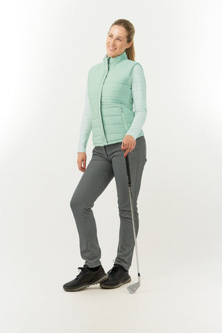 Frosted Sage Pure Golf Eve reversible ladies gilet for golf is insulated, winter-weight, patterned and reversible. It has been Insulated for warmth without being bulky. It has a unique frosted field, floral print  on one side and plain frosted sage on the other for versatility of wear. It has pockets on both sides and two-way zippers. The flattering quilting style and fit enhances your silhouette. 