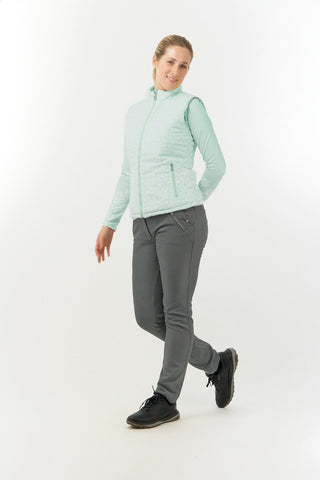 Frosted Sage Pure Golf Eve reversible ladies gilet for golf is insulated, winter-weight, patterned and reversible. It has been Insulated for warmth without being bulky. It has a unique frosted field, floral print  on one side and plain frosted sage on the other for versatility of wear. It has pockets on both sides and two-way zippers. The flattering quilting style and fit enhances your silhouette. 