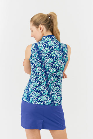 The Pure Golf Rise Sleeveless Women's Polo Shirt features a back view with prints that evoke a summery aquatic feel in multiple shades of blue. It is paired with the Yale Navy Skort. Designed with a regular fit, the polo provides 4-way stretch for comfort and a flattering silhouette on all body types. The elegant Mandarin collar adds a fashionable element. Crafted from 95% Polyester and 5% Spandex, it offers anti-crease, anti-static, and quick-dry benefits, along with UPF 50+ sun protection.