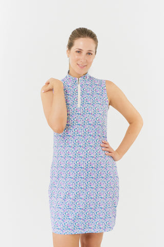 The Pure Golf model shot from the front of the Miley Sleeveless dress features our “Over Eighteen” print of cocktail motifs in a subtle scale and a mixture of blues, lilac and pinks. Made in 4-way stretch material for maximum flexibility and unrestricted movement with detachable shorts for versatility and coverage. The mock neck collar offers a modern look and is a flattering fit on all body types. Designed to be anti-crease, anti-static, and quick drying. It provides UPF 50+, 95% Polyester and 5% Spandex.