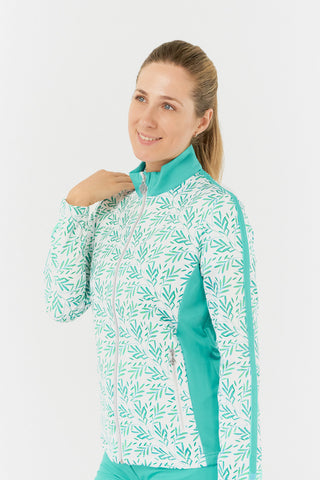 The close-up side model shot of the Pure Golf Gella Ladies Golf Mid Layer Jacket in Floating Palms White showcases a vibrant botanical print against a crisp white background, complemented by ocean block color accents on the mock neck, sides, and thin stripes along each arm. This regular-fit polo provides 4-way stretch for a flattering fit on all body types. Made from 95% Polyester and 5% Spandex, the jacket features anti-crease, anti-static, and quick-drying properties, along with UPF 50+.